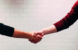 a handshake to represent saying no to a client in an email the right way