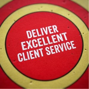 A red and yellow target with the words DELIVER EXCELLENT CLIENT SERVICE written in white text at the centre.